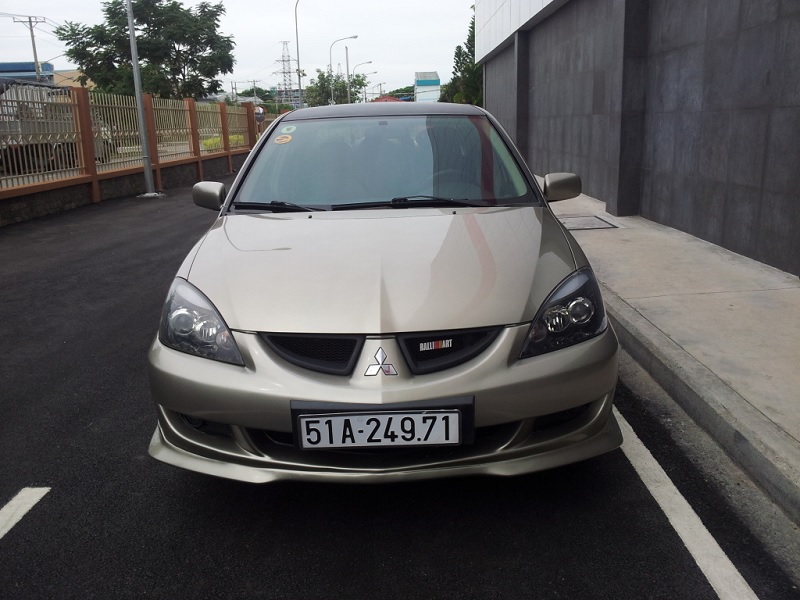 *THAY KÍNH XE Mitsubishi Lancer